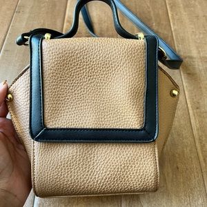 Tan/black , perfect sized crossbody. Great condition.